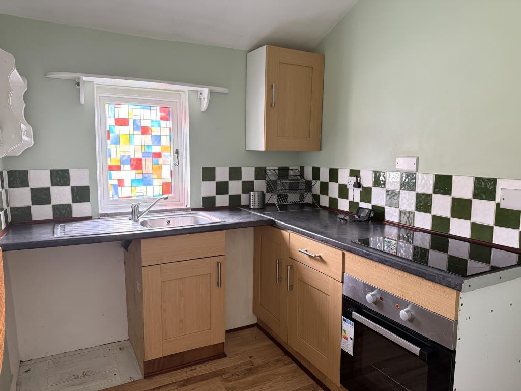 Lot: 142 - ONE-BEDROOM FLAT - Modern fitted kitchen with space for goods